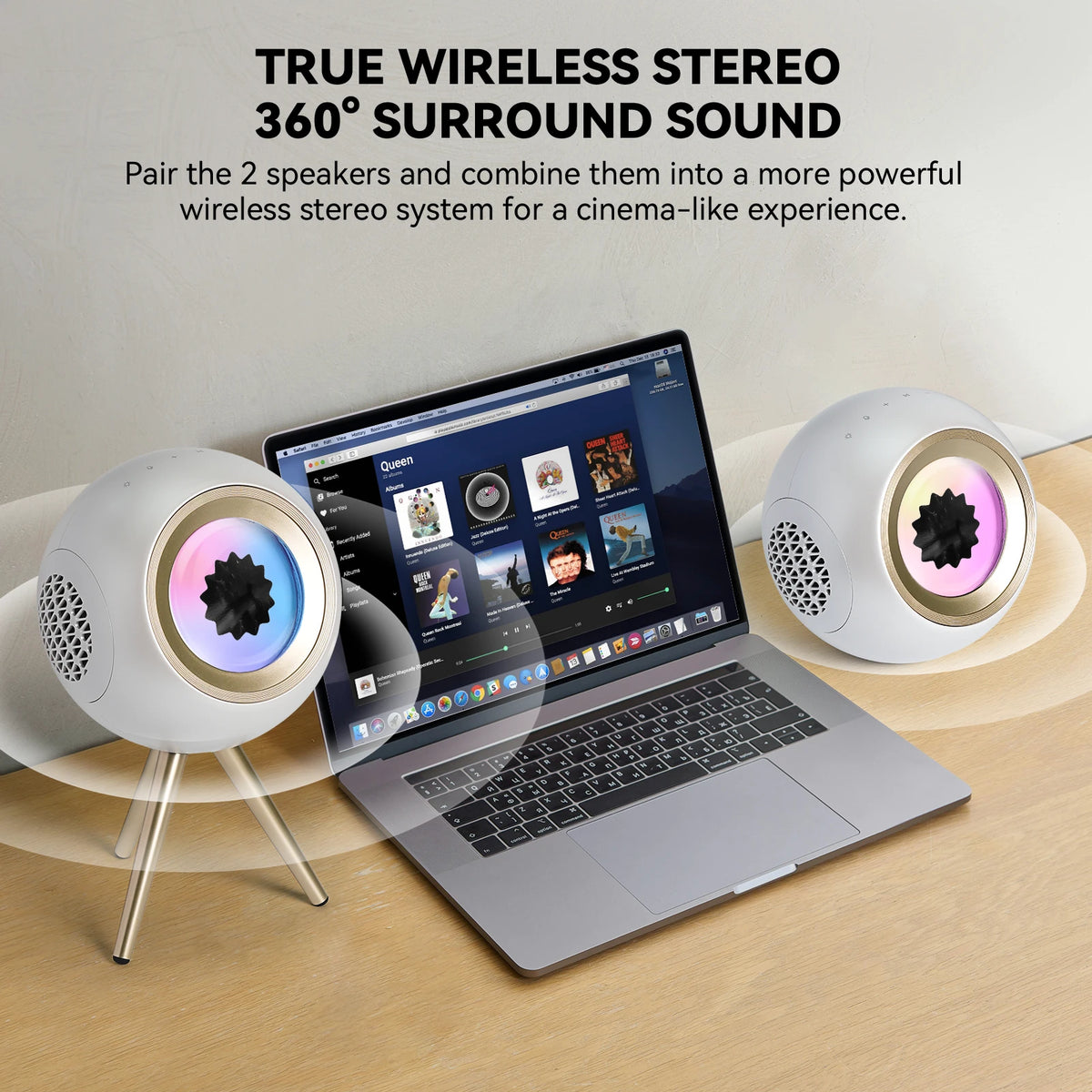 Two white VENOM BALL ferrofluid speakers paired in TWS 360 stereo mode on a desk