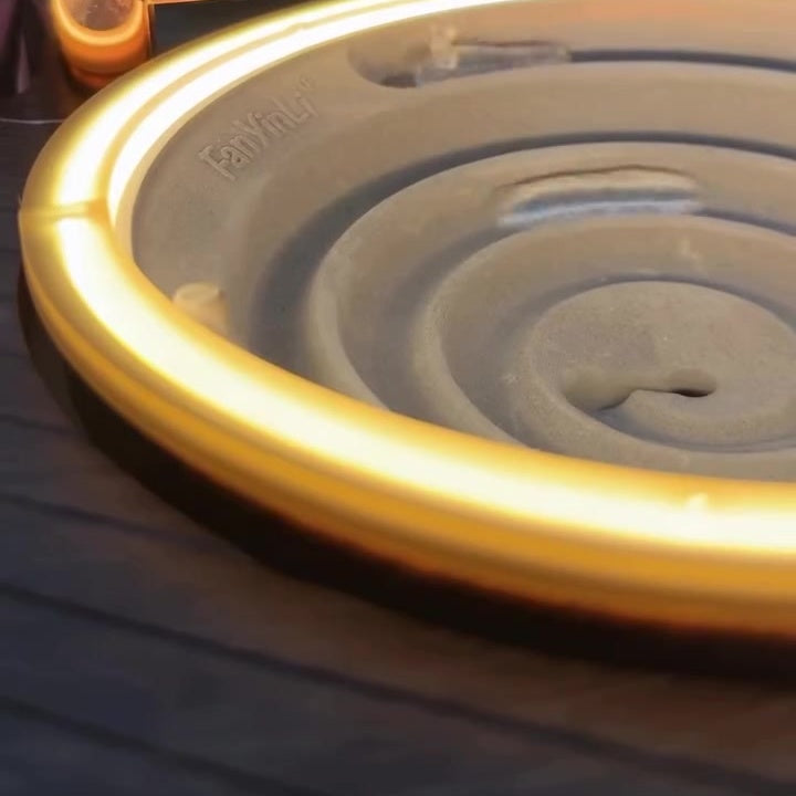 Copper tonearm and warm LED ring close-up